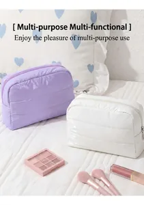 Close-up of lilac and white quilted puffer makeup bags showing waterproof texture