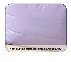 Detail of light purple quilted waterproof fabric with neat stitching on travel makeup bag