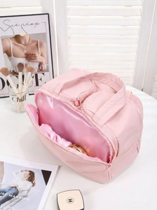 Detail view of pink multi-pocket travel makeup bag with durable nylon and zipper layout