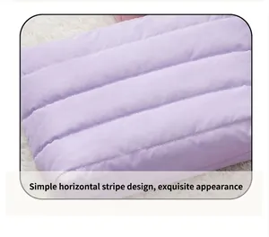 Detail of purple quilted horizontal stripes on a compact portable makeup storage bag