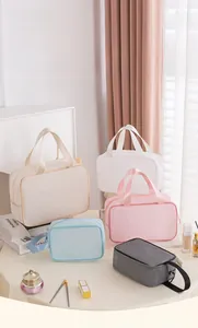 Close-up of mesh makeup bags in five pastel colors showing dry and wet separation detail