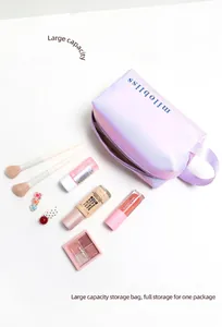 Large capacity holographic makeup bag showing interior storage for brushes and palettes
