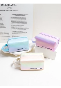 Detailed view of iridescent laser makeup bags with gradient colors and portable handles