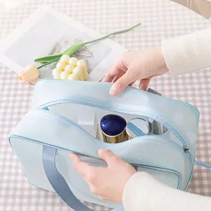 Large capacity light blue mesh makeup bag with double zippers and handle for travel