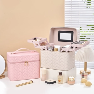 Quilted leather vanity box with tiered trays, mirror and large capacity storage