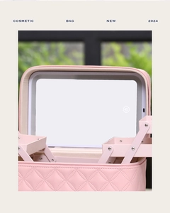 Pink quilted PU makeup case with integrated LED mirror and folding storage trays