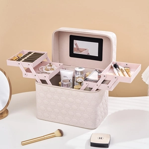 Pink quilted PU makeup case with multi-layer folding trays and an integrated mirror