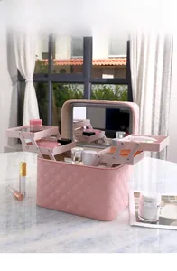 Pink quilted PU makeup case featuring a multi-tier expanding structure and built-in LED mirror