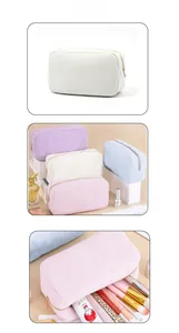 Vista dettagliata della trama in velluto e zip dorata sui beauty case macaron