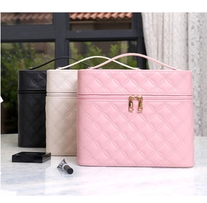 Quilted diamond pattern PU leather makeup bags with sturdy handles and gold zippers