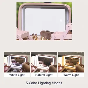 Pink quilted makeup case with LED mirror showing three adjustable light modes and tiered trays