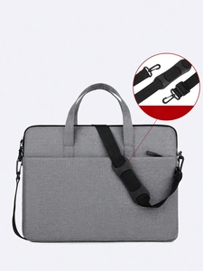 Détail de la bandoulière amovible avec boucle en métal sur sacoche PC grise