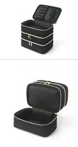 Detailed view of the triple-layer quilted makeup bag with gold zippers and brush slots