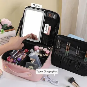 Pink leather makeup bag with built-in LED mirror and adjustable storage compartments
