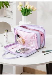 Detail view of the purple makeup bag interior with brush slots and large storage