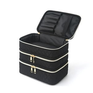 Three-layer quilted black makeup bag with large capacity and gold zippers for travel