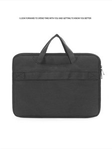 Detail of durable black oxford fabric laptop bag with reinforced handles and smooth zipper
