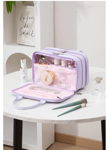 Detail view of the multi-layered lavender makeup bag with internal mesh compartments