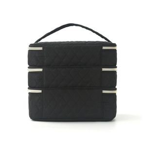 Three-layer quilted diamond pattern makeup bag with gold zippers and sturdy top handle