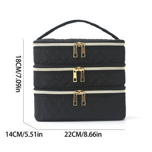 Three-layer quilted black makeup bag with gold zippers and top handle, size 22x14x18cm