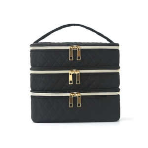 Three-layer quilted black makeup bag with large capacity and gold zippers for travel