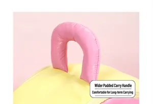 Close-up of padded leather handles on yellow and pink house-shaped cosmetic bag