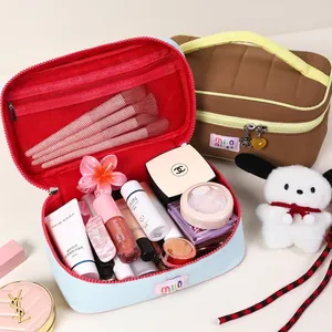 Spacious dopamine macaron colored makeup bag with quilted texture and double zippers