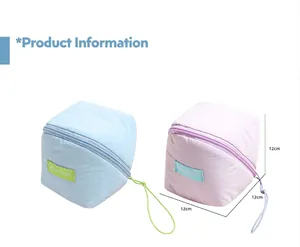 Detailed view of sky blue and light purple 12cm cube cosmetic bags with side labels