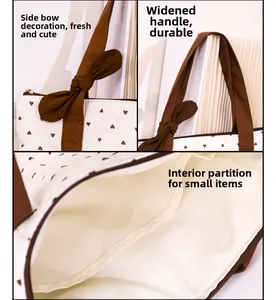 Detail view of white quilted tote with heart patterns, bow decor and inner pockets