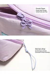 Detail of lilac cloud makeup bag featuring bow zipper and light blue hand strap