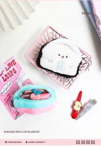 Detail of plush house-shaped coin purse and oval organizer with zipper closure inside a basket