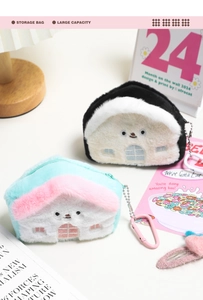 Detail of house-shaped plush coin purse with embroidery, metal chain and carabiner clip