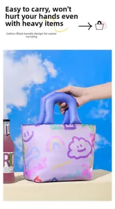 Detail of the soft cotton-filled handle on a purple geometric tote bag for comfortable carrying