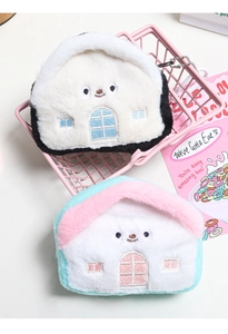 Close-up of cute plush house coin purses with detailed embroidery and metal bead chains