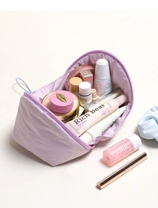 Macro detail of spacious lavender cloud makeup bag showing large storage capacity