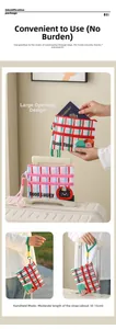 Detail of travel passport holder featuring cute cartoon prints and luggage strap handle