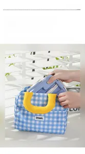 Detail showing checkered lunch bag interior with large capacity and bento box storage