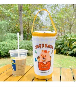 Detail of yellow checkered insulated cup sleeve with cute cartoon capybara print