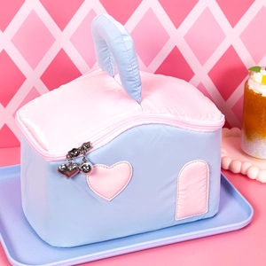Pink and blue quilted house-shaped makeup bag with heart details and metal zipper charm