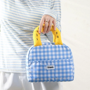 Blue and white checkered insulated lunch bag with yellow handles and Dream label
