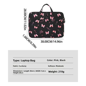 Detailed view of black corduroy laptop sleeve with pink bows and size 38x28x1cm specs