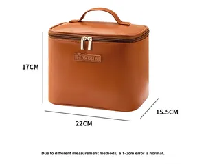 Detailed size view of a 22x17x15.5cm brown leather makeup bag with dual zippers