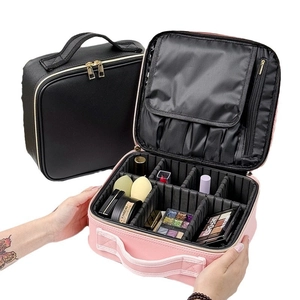 Portable waterproof makeup case with adjustable dividers and brush slots in black and pink
