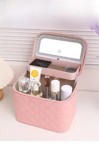 Detail of LED makeup case showing pink quilted PU finish and ring light vanity mirror