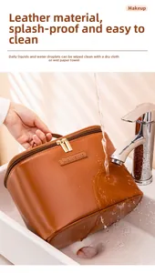Close-up of waterproof brown leather makeup bag showing splash-proof surface and zipper