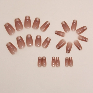 Short ballerina press-on nails with nude base and metallic gold French tips set