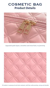 Detail of pink quilted PU leather makeup bag showing smooth gold zippers and waterproof fabric