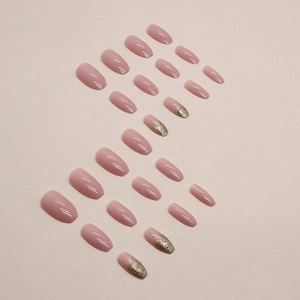 Short ballet pink press-on nails with silver glitter accent in 24 piece nail kit