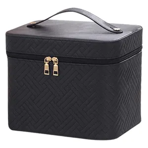 Large black woven pattern makeup case with top handle and gold zipper closure