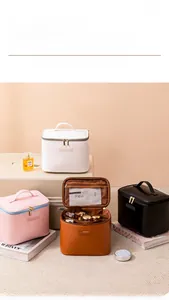 Internal view of a multi-compartment leather makeup bag with mesh pockets and dividers